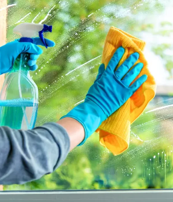 Technician performing window cleaning in Concord NC"